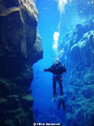 This is my Brother Svanur in the Canyon "Silfra" in "Thin... by Hilmar Sævarsson 